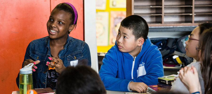 Young people discussing in a classroom