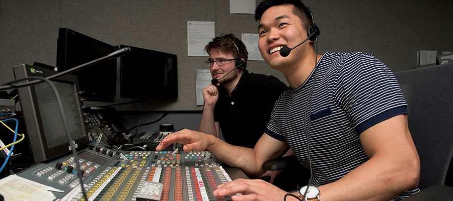 A young person and his supervisor working radio controls