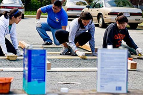 Young people working on painting and construction